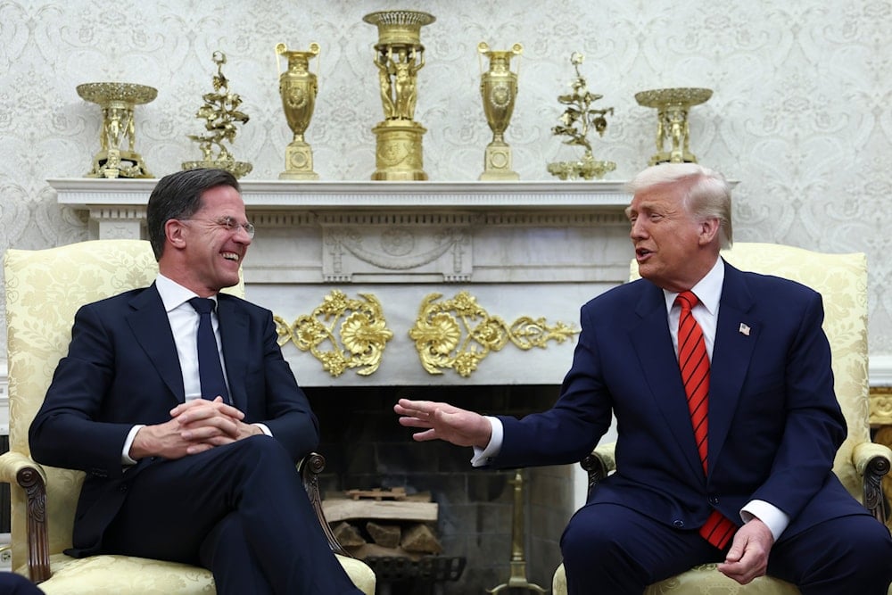 President Donald Trump, right, speaks during a meeting with NATO Secretary General Mark Rutte at the White House in Washington, Thursday, March 13, 2025. (Pool via AP)