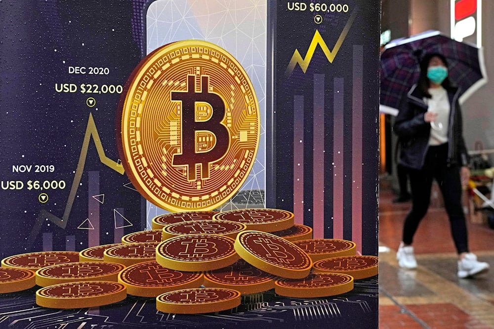 An advertisement for Bitcoin cryptocurrency is displayed on a street in Hong Kong, on Feb. 17, 2022 (AP)