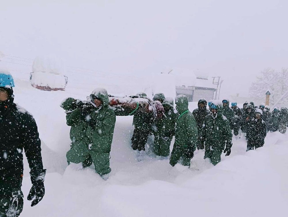 a team carries out rescue operations for trapped construction workers who were swept away by an avalanche near the Mana Pass in northern Uttarakhand state in Chamoli district, India, Friday, Feb. 28, 2025. (AP)