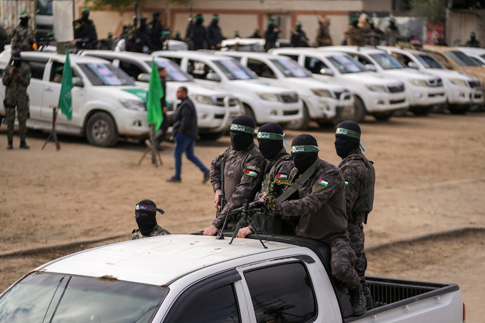 Hamas resistance fighters deploy ahead of the hand over to the Red Cross of three Israeli captives as part of the Gaza ceasefire deal with “Israel” in Deir Al-Balah, central Gaza Strip, and Saturday Feb. 8, 2025. (AP)