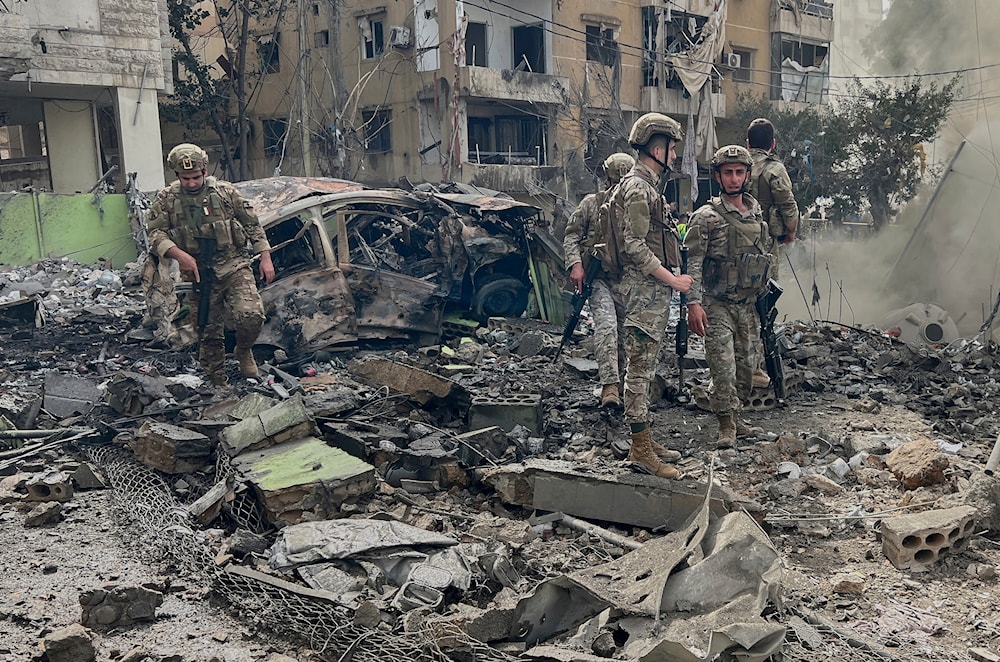 Lebanese army soldiers inspect the site that was hit by an Israeli airstrike in Dahiyeh, in the southern suburb of Beirut, Lebanon, Friday March 28, 2025 (AP)