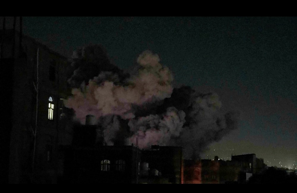 In this image made from video, smoke rises after a blast in Sanaa, Yemen, Friday, March 28, 2025. (AP Photo)