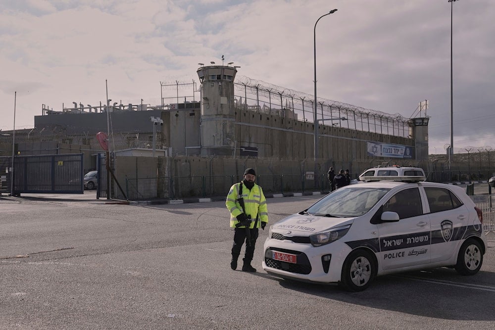 Israeli security personnel stand outside Ofer military prison near Jerusalem on Saturday, Feb. 8, 2025 (AP)