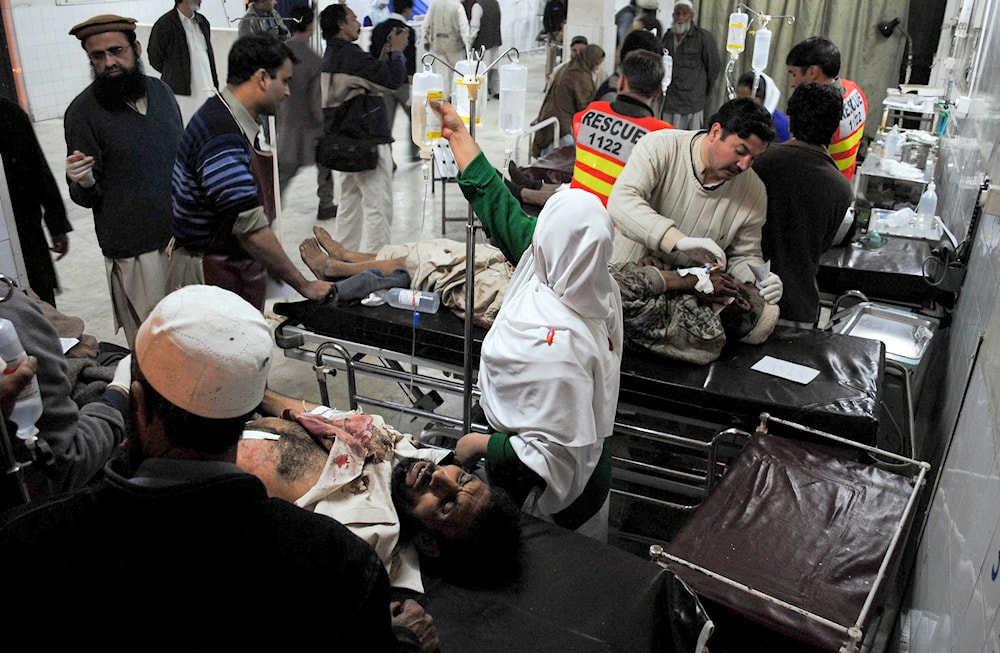Inured victims of suicide bombing are treated at Lady Reading hospital in Peshawar, Pakistan on Saturday, Dec. 25, 2010. (AP)