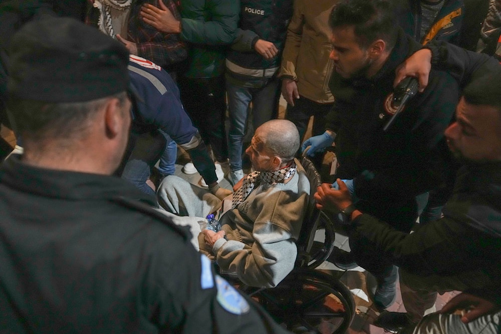 A Palestinian prisoner on a wheelchair is greeted upon his arrival after being released from an Israeli prison in the West Bank city of Ramallah, Thursday Jan. 30, 2025.(AP Photo/Nasser Nasser)