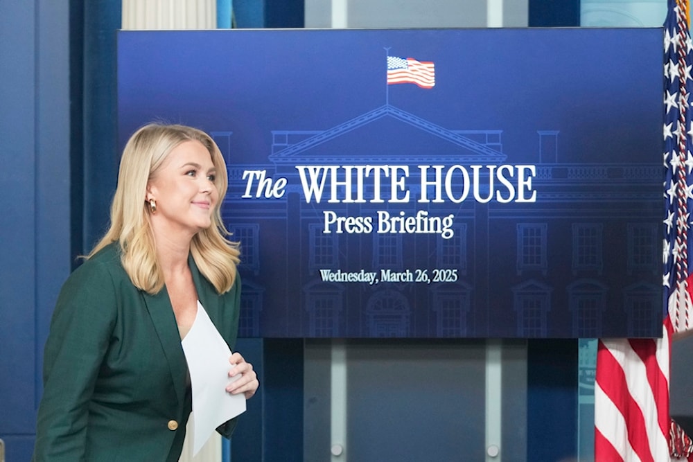 White House press secretary Karoline Leavitt arrives for a briefing at the White House, Wednesday, March 26, 2025, in Washington. (AP Photo/Mark Schiefelbein)
