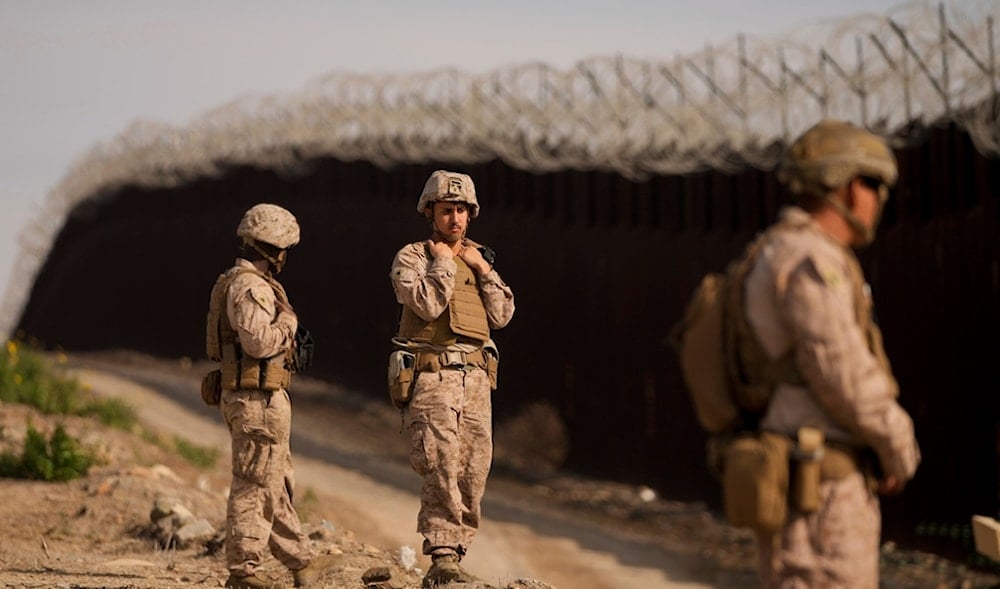 U.S. Marines install barbed wire along the border fence Friday, Jan. 31, 2025, in San Diego. (AP)