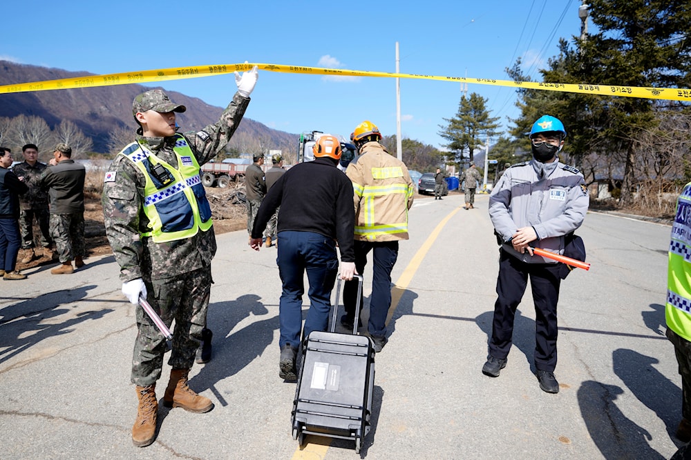 Firefighters arrive near the scene where a South Korean fighter jet accidentally dropped bombs on a civilian area during training, in Pocheon, South Korea, Thursday, March 6, 2025. (AP)