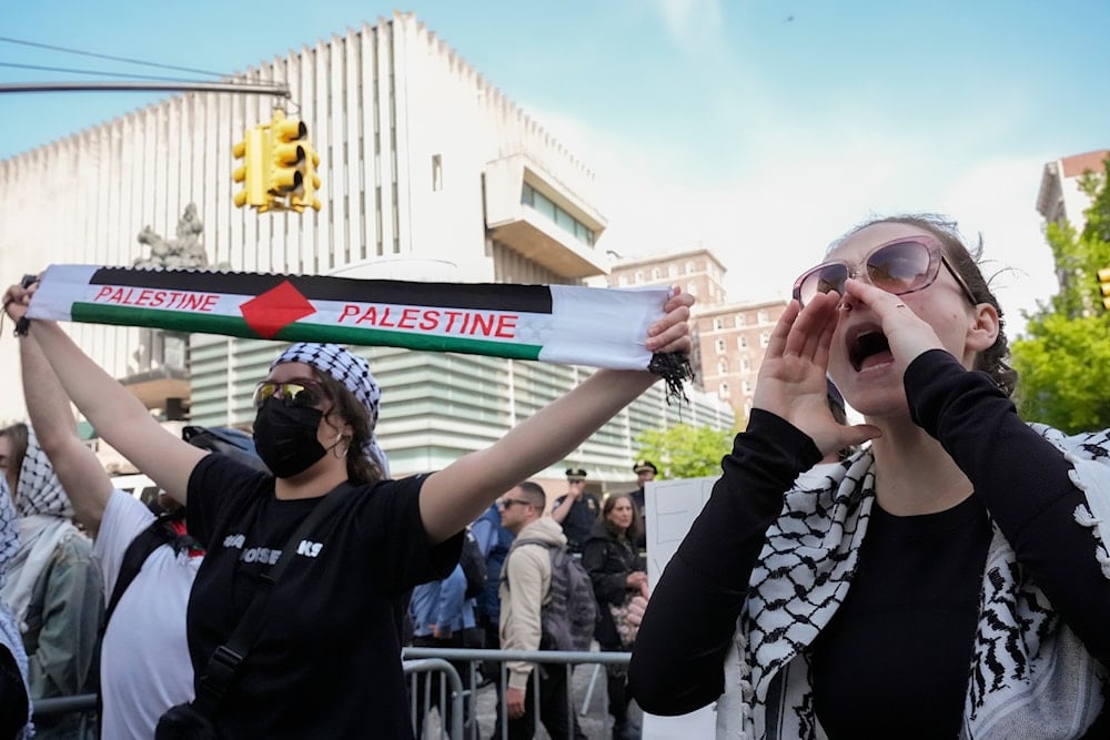 Protesters demonstrate against the Israeli war on Gaza outside the entrance to the campus of Columbia University, Tuesday, April 30, 2024, in New York. (AP)