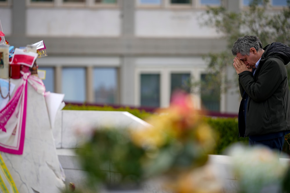 A man prays for Pope Francis in front of the Agostino Gemelli Polyclinic, in Rome, Saturday, March 8, 2025, where the Pontiff is hospitalized since Feb. 14. (AP)