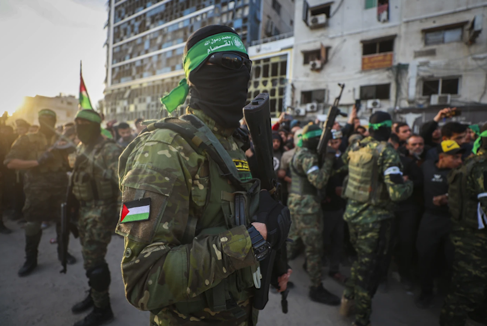 Al-Qassam Brigades Fighters, military wing of Hamas, during hostage exchange, Gaza, January 19, 2025 (AP/Abed Hajjar)