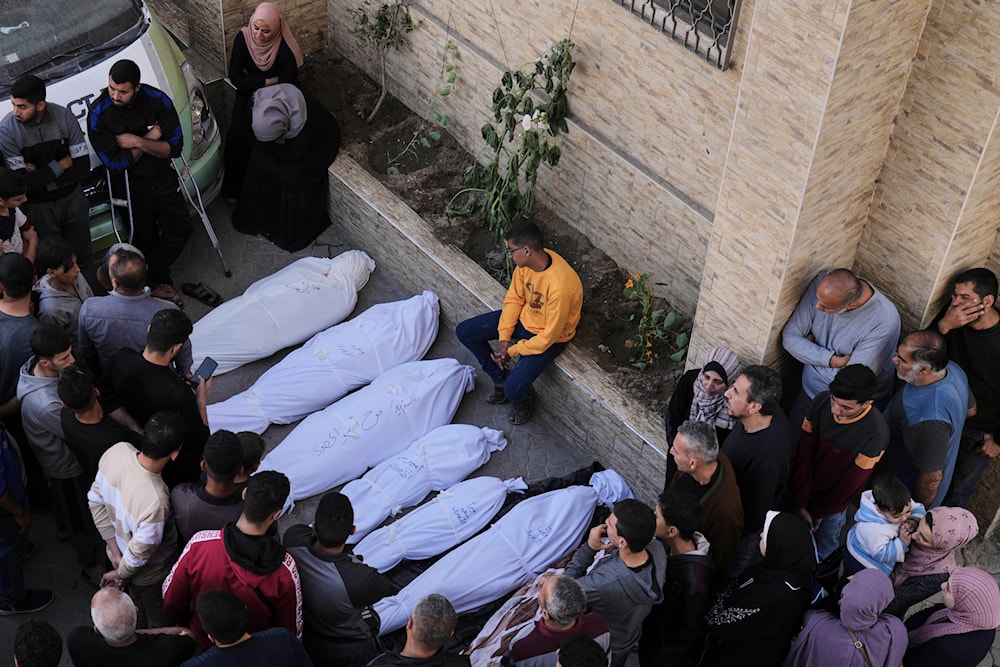 Palestinians grieve over the bodies of their relatives, who were killed in an Israeli airstrike, at the Baptist Hospital in Gaza City, on Thursday, April 3, 2025. (AP)