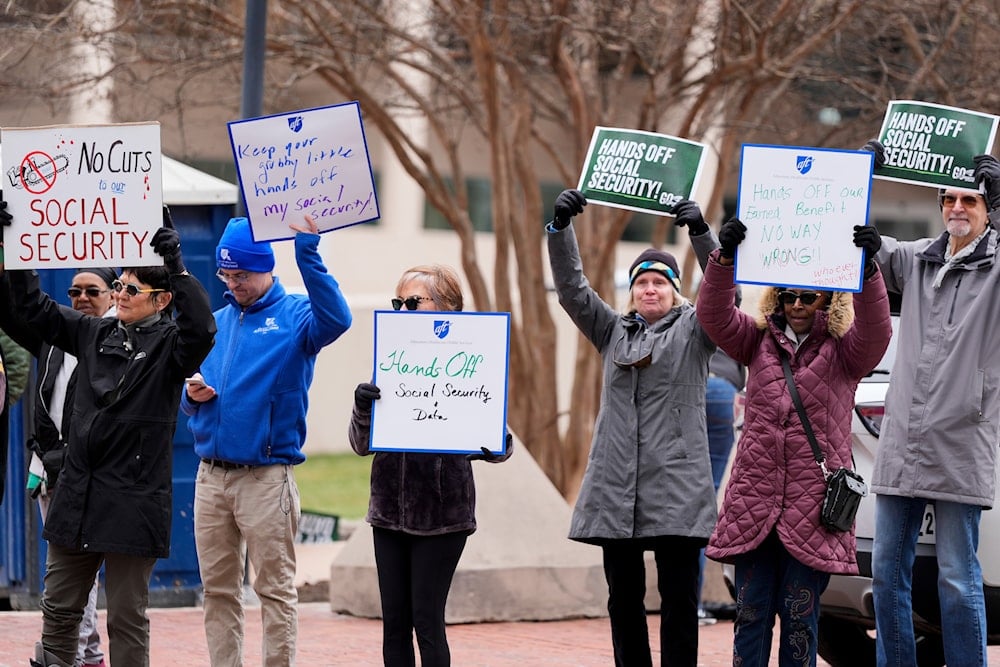 Demonstrators gather outside of the Edward A. Garmatz United States District Courthouse in Baltimore, on Friday, March 14, 2025, before a hearing regarding the Department of Government Efficiency's access to Social Security data. (AP)