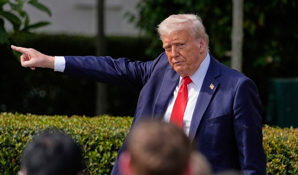 President Donald Trump gestures to the crowd as he departs after welcoming the 2025 College Football National Champions, the Ohio State University football team, during an event in the White House, April 14, 2025, in Washington. (AP)