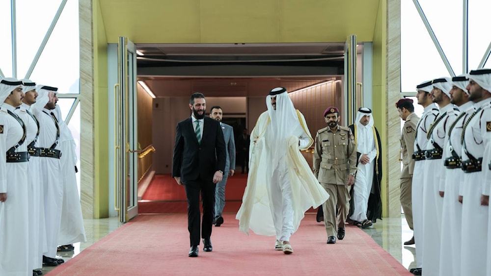 Syrian Interim President Ahmed Al-Sharaa is greeted by Sheikh Tamim bin Hamad Al Thani upon the former's arrival in Qatar. (@syrianmofaex)