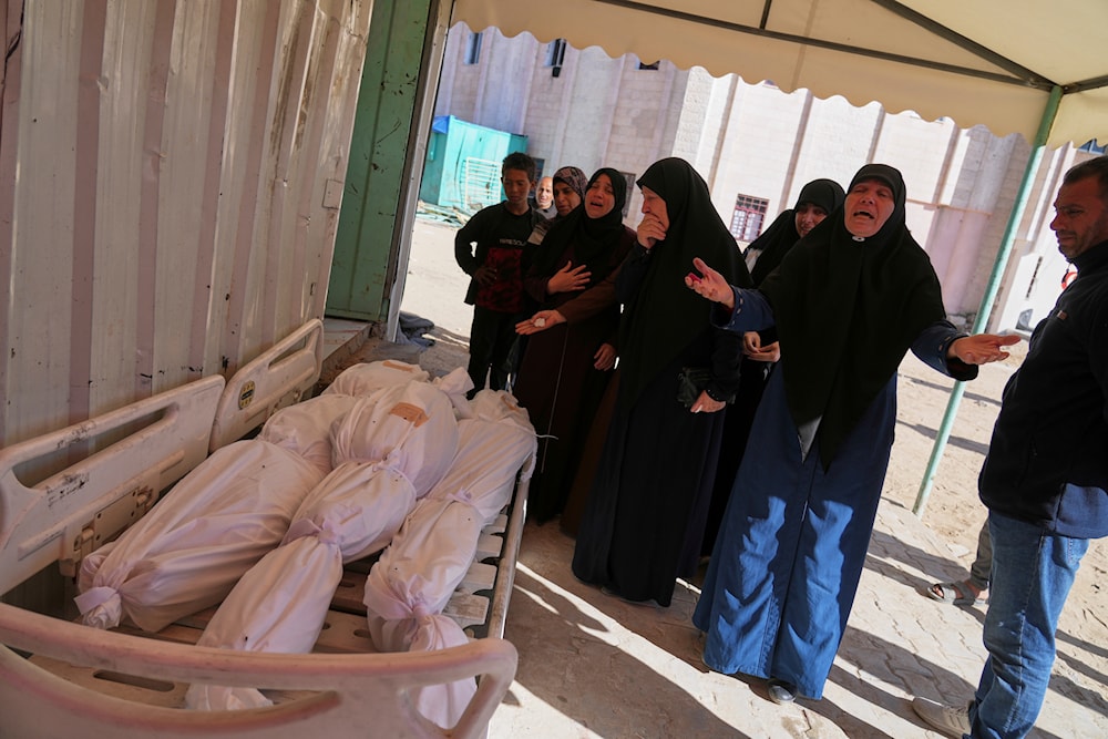 Relatives mourn over the bodies of several members of the al-Atal family, killed in an Israeli airstrike on a tent in the Jabalia refugee camp, before their burial at the Indonesian hospital in Beit Lahia, northern Gaza Strip, Thursday, April 17, 2025.(AP)