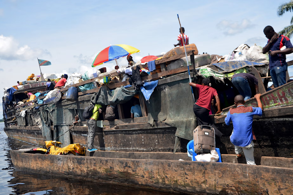 Rescue efforts continue after the fire and sinking of a boat on the Congo River. Photograph: Junior Kannah/AFP/Getty Images
