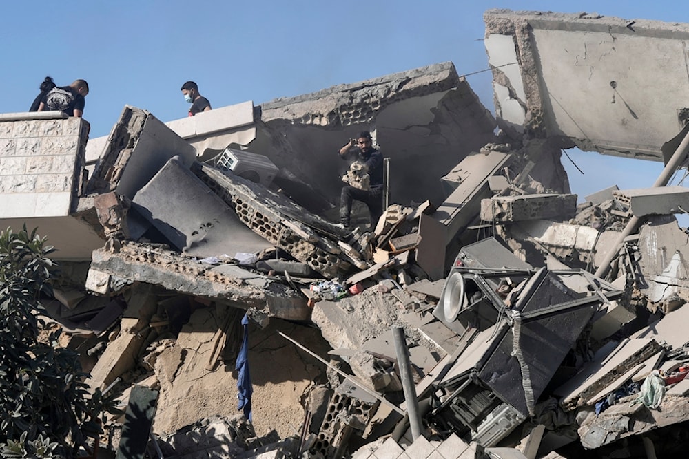 Residents of a building damaged in an Israeli airstrike return to collect their belongings in Hadath, south of Beirut, Lebanon, Sunday, November 17, 2024 (AP)