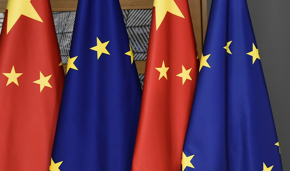 The Chinese Flags, far left, appear next to the European Union Flags in this undated photo (Photograph: John Thys/AP)