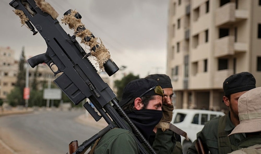 Members of Syria's security forces deploy during an operation in the edge of the town of Sahnaya, south of Damascus, Wednesday April 30, 2025. (AP)