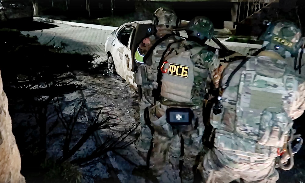 In this photo taken from video released by the National Antiterrorism Committee on Monday, June 24, 2024, FSB officers conduct a counter-terrorist operation in the Republic of Dagestan, Russia. (AP)