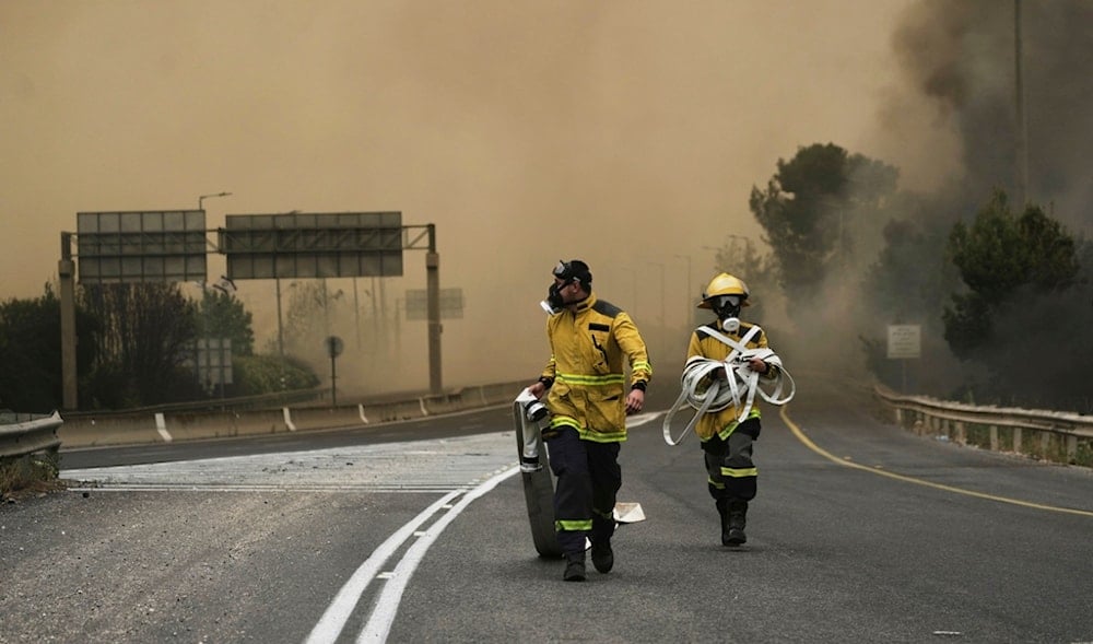 Israeli firefighters work to extinguish a forest fire burning near occupied al-Quds, Wednesday, April 30, 2025. (AP)