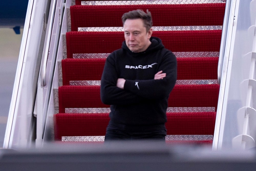 Elon Musk arrives on Air Force One at Philadelphia International Airport, March 22, 2025, in Philadelphia (AP)