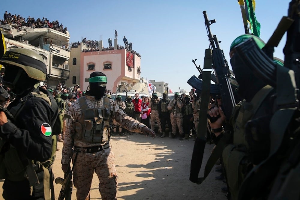 Hamas and Palestinian Islamic Jihad militants secure the area as Red Cross representatives wait for the handover of Thai and Israeli captives in Khan Younis, southern Gaza Strip, Thursday Jan. 30, 2025 (AP)