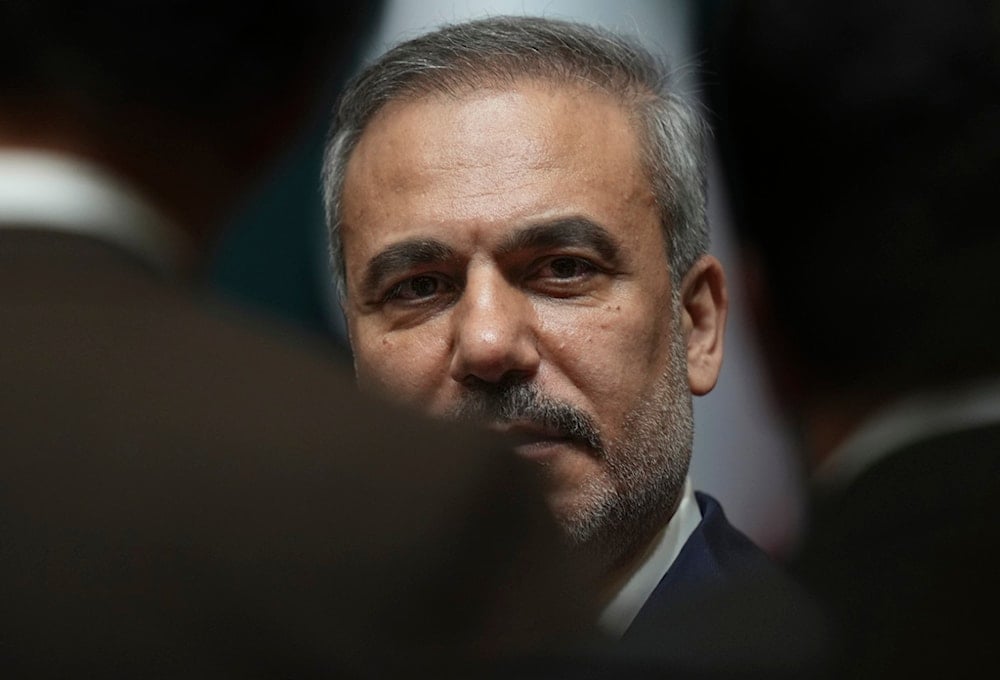 Turkish Foreign Minister Hakan Fidan speaks to media before a joint press conference for Turkish President Recep Tayyip Erdogan and Syria's interim President Ahmad al-Sharaa in Ankara, Turkey, Tuesday, February 4, 2025 (AP)