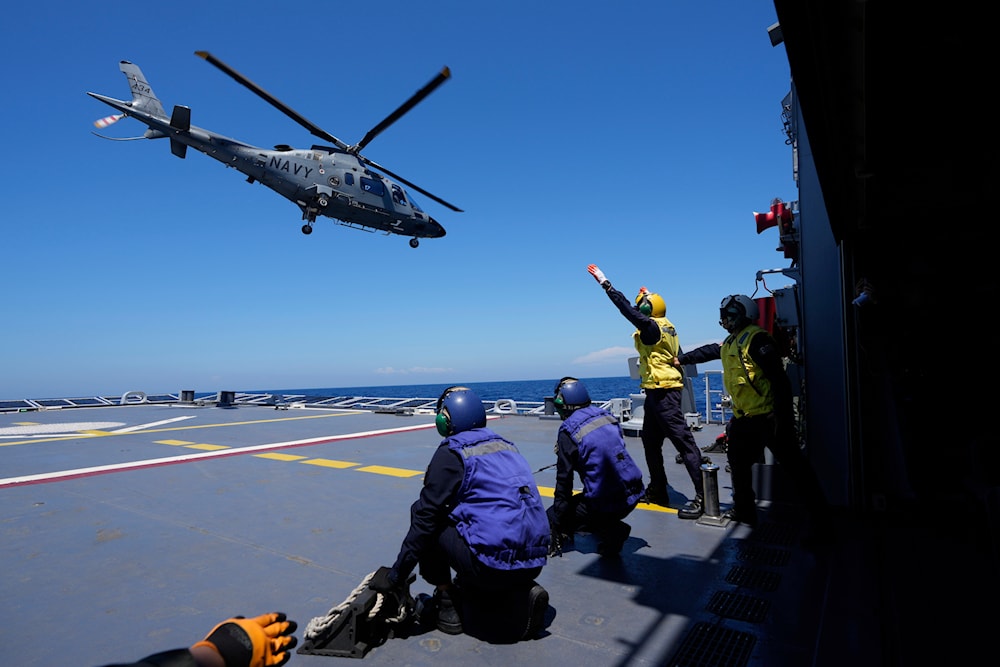 A Philippine Navy AW109 helicopter takes off from Philippine Navy Ship Jose Rizal during the Philippines United States Japan Multilateral Maritime Cooperative Activity off a disputed South China Sea shoal on Friday, March 28, 2025. (AP)