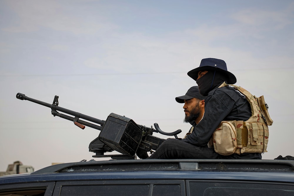 Syria's security forces are deployed at a highway where they found bodies of Syrian Druze fighters who were in a convoy heading from the southern Sweida province, Syria, May, 1, 2025 (AP)