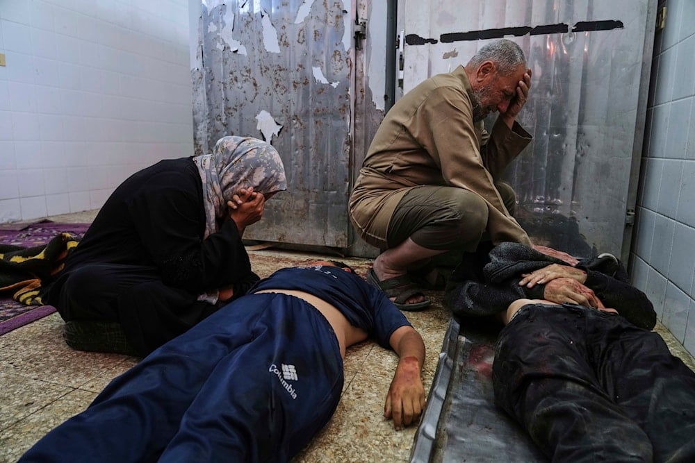 alestinian mourn their relatives who were killed in an Israeli army airstrike on the Gaza Strip, at the morgue of Al-Aqsa Hospital in Deir al-Balah, Gaza, on April 27, 2025. (AP Photo/Abdel Kareem Hana)