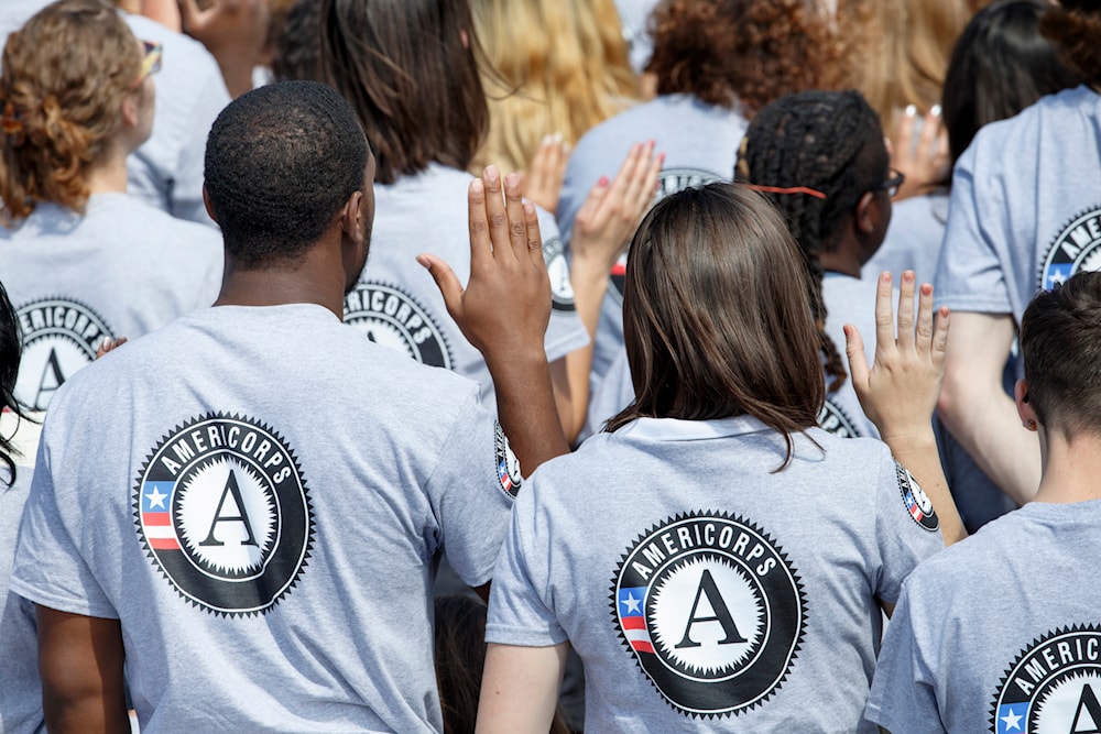 Hundreds of new volunteers are sworn in for duty at a ceremony, Friday, Sept. 12, 2014, on the South Lawn of the White House in Washington  marking that the 20th anniversary of the AmeriCorps national service program. (AP)