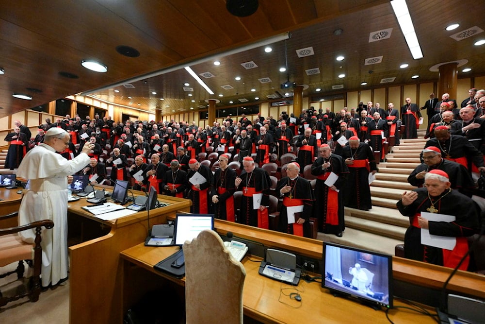 Pope Leo XIV meets the College of Cardinals in the New Synod Hall at the Vatican, Saturday, May 10, 2025. (Vatican Media via AP)