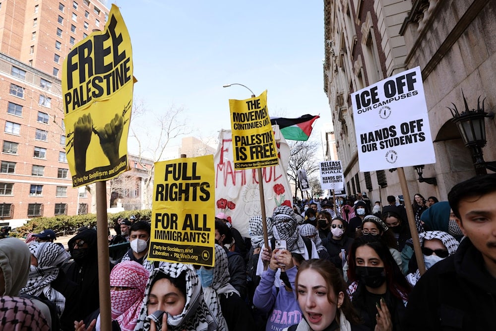 Protesters rally in support of detained Palestinian activist Mahmoud Khalil outside Columbia University in New York on Friday, March 14, 2025 (AP)