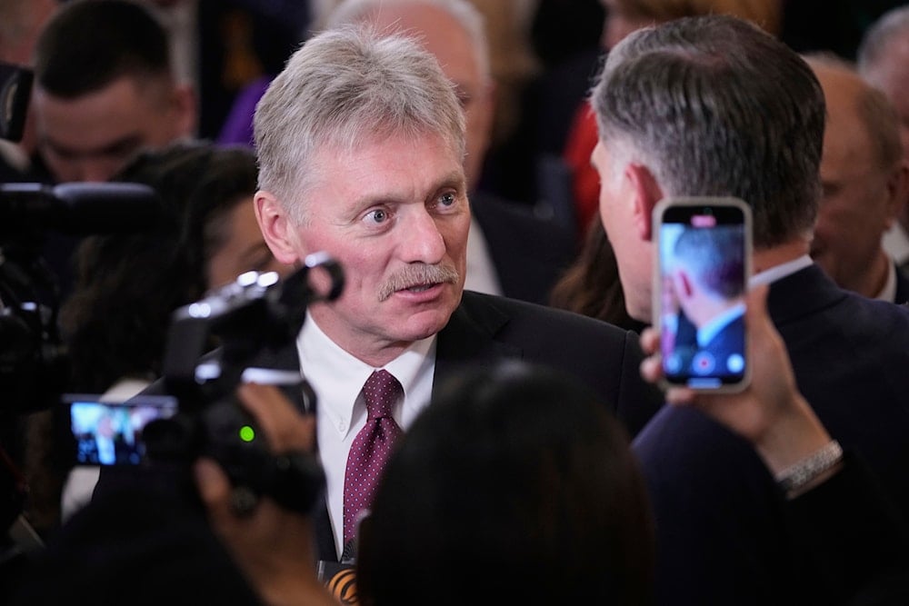 Kremlin spokesman Dmitry Peskov, left, speaks with journalists prior to a signing ceremony after a meeting between Chinese President Xi Jinping and Russian President Vladimir Putin at the Kremlin in Moscow, Russia, Thursday, May 8, 2025 (AP)