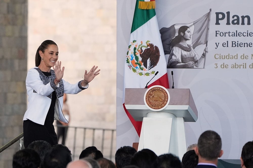 Mexican President Claudia Sheinbaum waves upon arrival for an event with national business leaders at the Anthropology Musuem in Mexico City, Thursday, April 3, 2025 (AP)