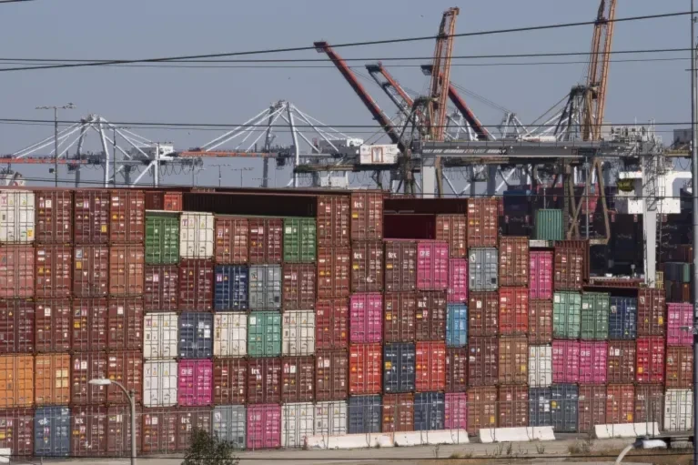 Cargo containers sit stacked at the Port of Los Angeles in San Pedro, California, October 19, 2021 (AP/Damian Dovarganes)