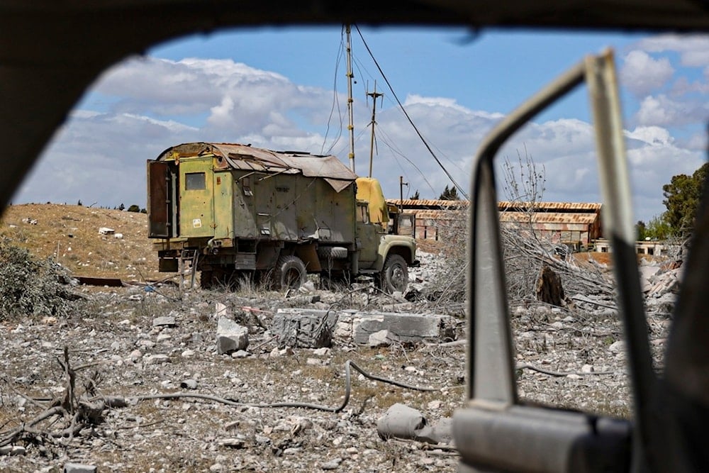 Debris is scattered at the site of an Israeli strike on a military airbase near Hama, Syria, Thursday, April 3, 2025 (AP)