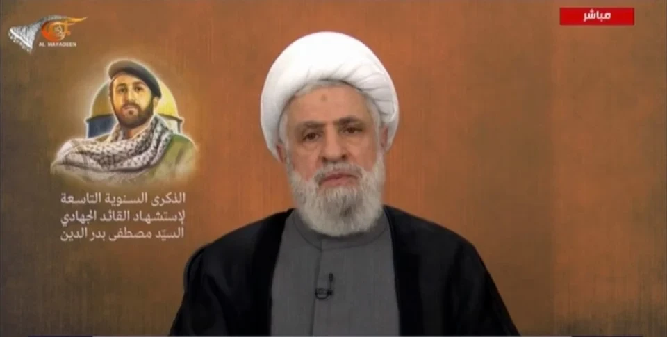 Hezbollah Secretary-General Sheikh Naim Qassem gives a speech to commemorate martyr Sayyed Mustafa Badreddine on May 12, 2025 (Al Mayadeen Screengrab)