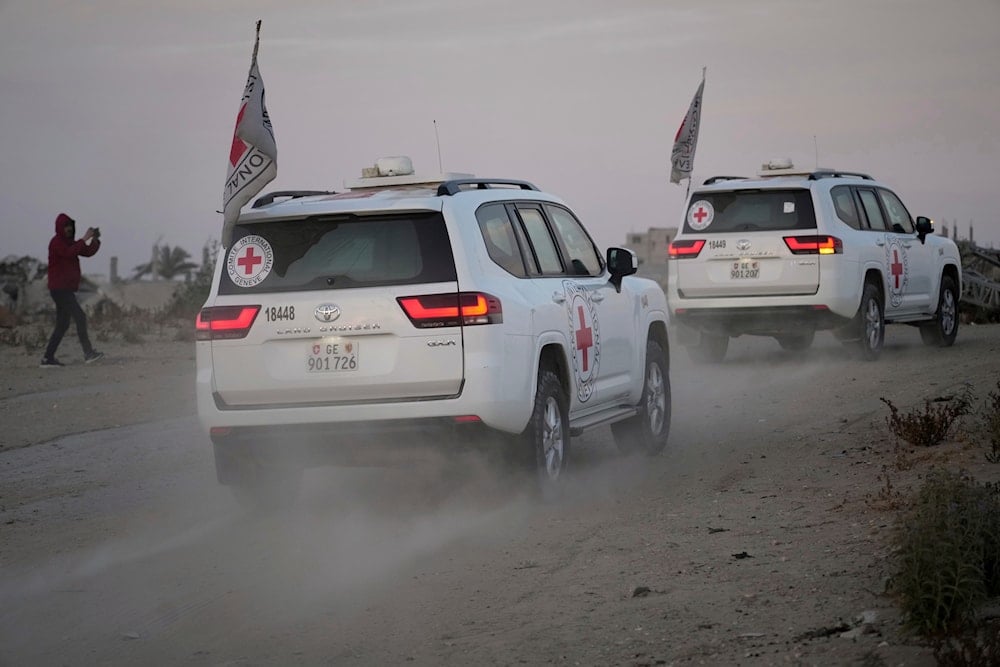 Red Cross vehicles carrying American-Israeli captive soldier Edan Alexander leave the Gaza Strip after he was handed over to the organization, Monday, May 12, 2025 (AP)
