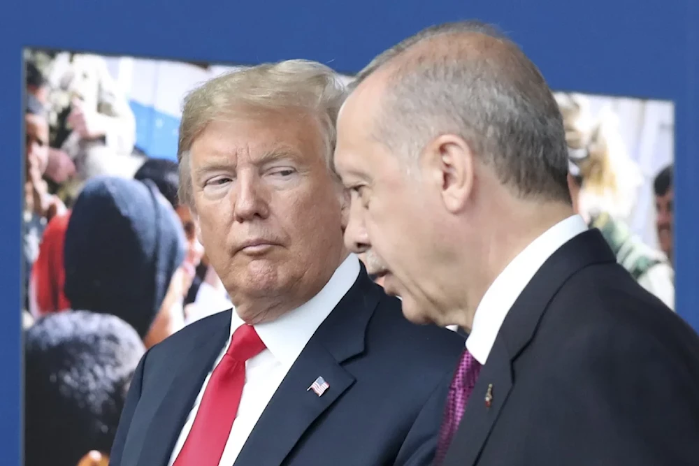 In this July 11, 2018 file photo, US President Donald Trump, left, talks to Turkish President Recep Tayyip Erdogan as they tour the new NATO headquarters in Brussels, Belgium. (Tatyana Zenkovich/AP)