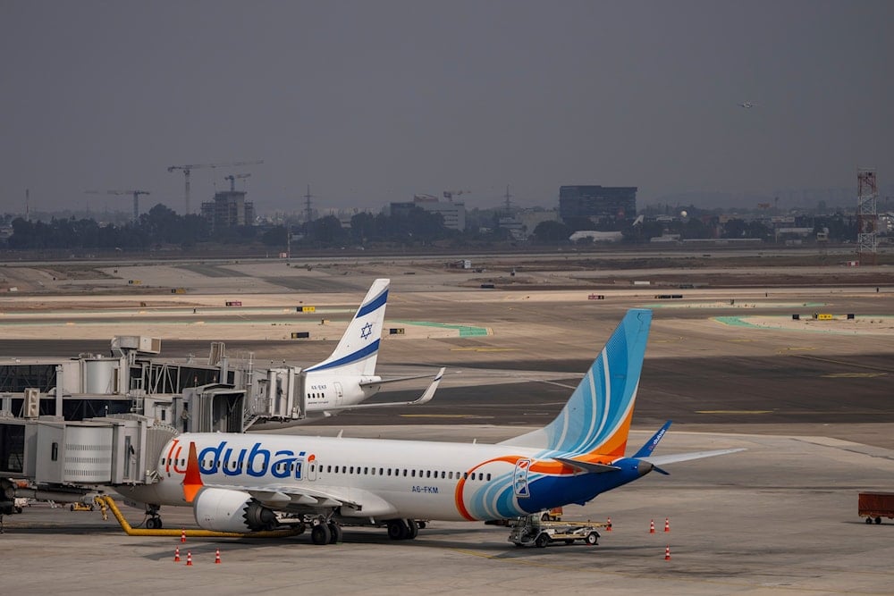 A Fly Dubai plane is parked on the tarmac at Ben Gurion International Airport in the Occupied Palestinian Territories, Sunday, Nov. 10, 2024 (AP)