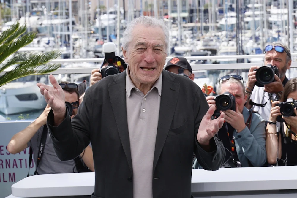 Honorary Palme d'Or recipient Robert De Niro poses for photographers during a photo call at the 78th international film festival, Cannes, Southern France, May 13, 2025 (Joel C Ryan/AP)