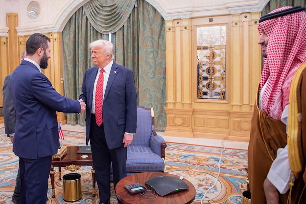 In this photo released by the Saudi Royal Palace, Syria's interim President Ahmad al-Sharaa, left, shakes hands with President Donald Trump, center, in Riyadh, Saudi Arabia, Wednesday, May 14, 2025. At right is Saudi Crown Prince Mohammed bin Salman. (AP)