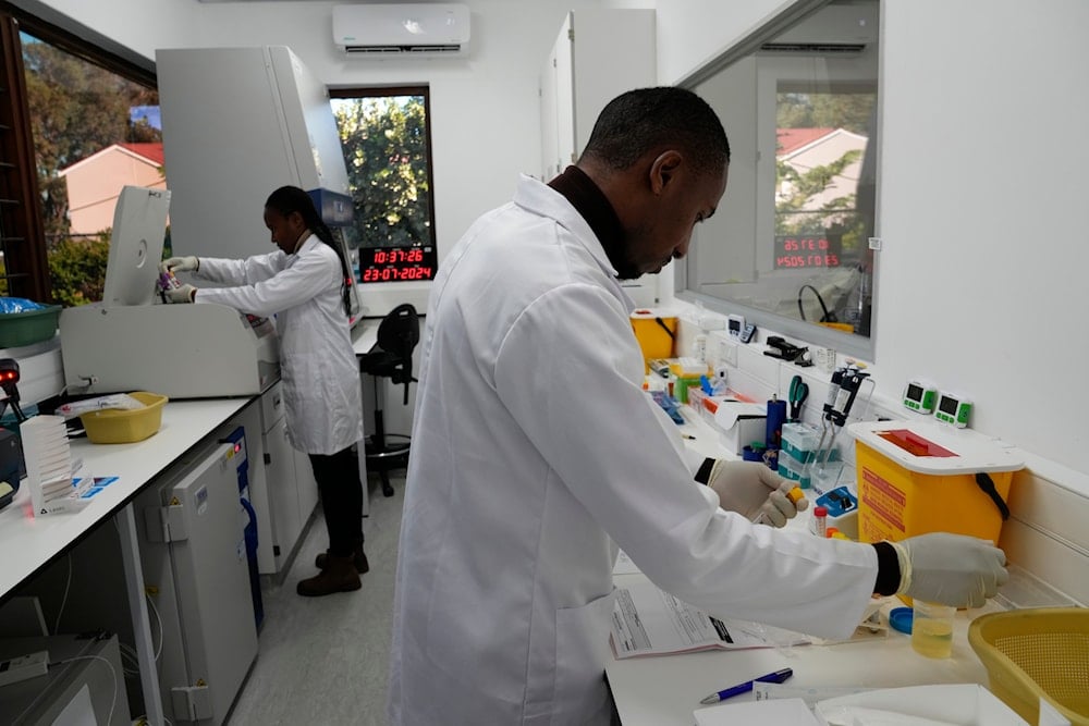 Lab technician Xolile Mhlanga works with vials of lenacapavir at the Desmond Tutu Health Foundation's Masiphumelele Research Site, in Cape Town, South Africa, Tuesday, July 23, 2024 (AP)
