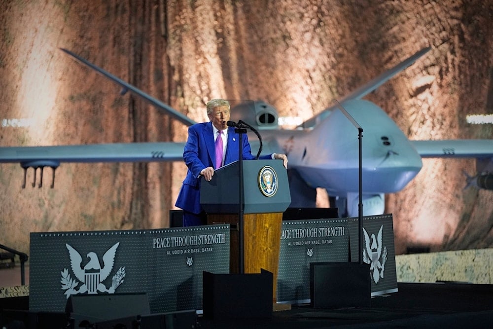 President Donald Trump speaks backdropped by an MQ-9 Reaper drone at the Al Udeid Air Base, Thursday, May 15, 2025, in Doha, Qatar (AP)