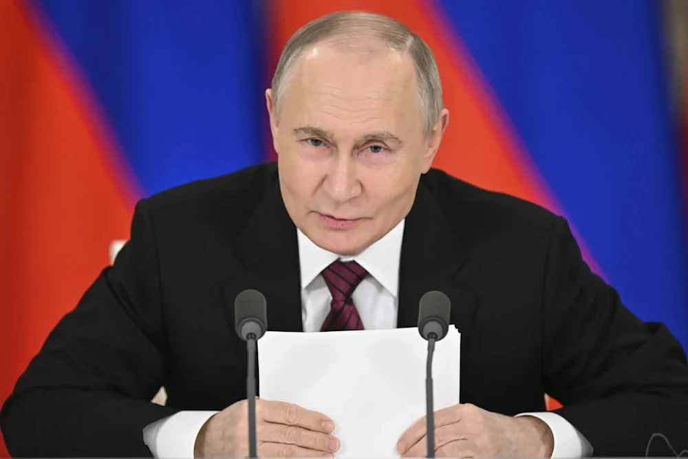 Russian President Vladimir Putin gestures as he speaks to journalists in the Grand Kremlin Palace in Moscow, May 11, 2025 (Sergei Bobvlev/AP)