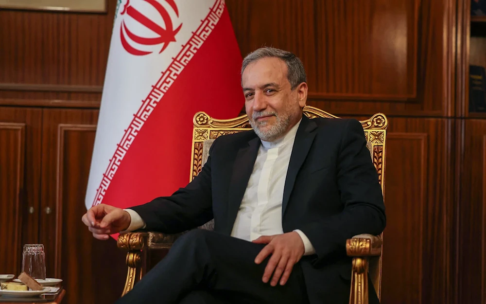 Iranian Foreign Minister Abbas Araghchi sits for a meeting with the International Atomic Energy Agency director in Tehran on November 14, 2024 (Atta Kenare/AFP)