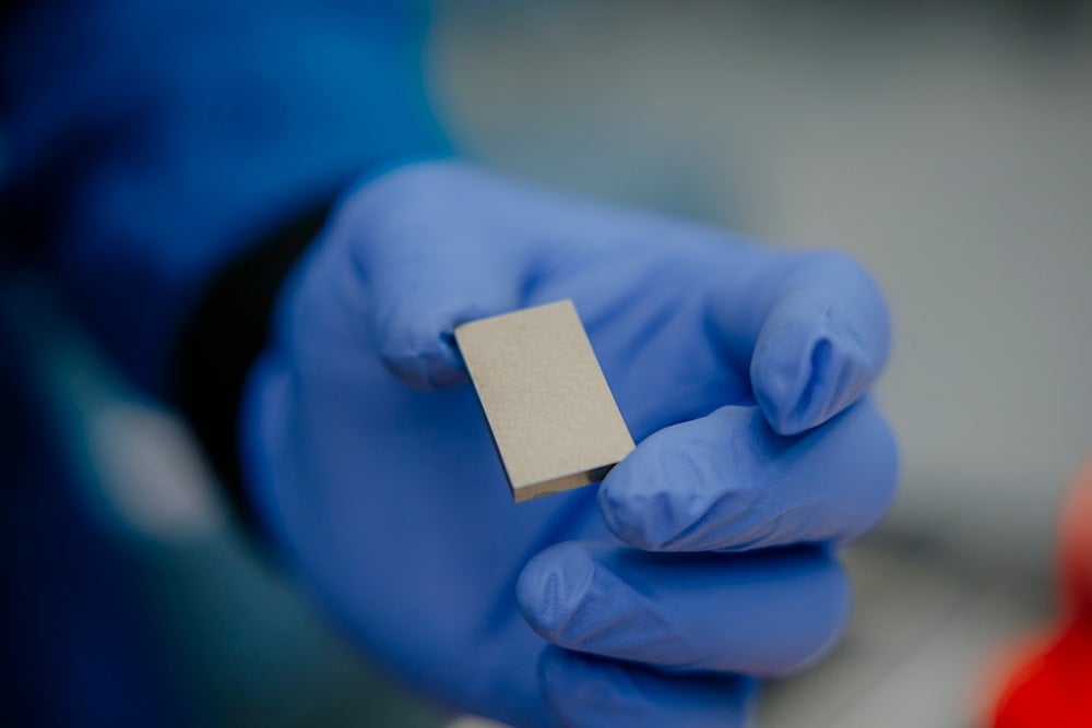 A rare earth magnet being inspected at MP Materials' Independence facility in Fort Worth, Texas (AP)